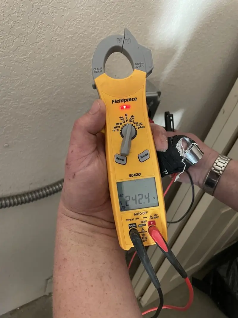 Voltage testing with clamp meter during Hot Tub / Pool Electrical Wiring in Roy